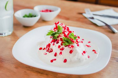 chiles en nogada, traditional Mexican dish with poblano chili peppers and walnut sauce from Puebla Mexico clipart