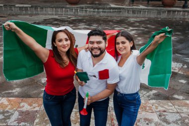 Mexican people with flag in mexican independence day in Mexico clipart