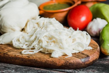 Oaxaca cheese called quesillo traditional from Oaxaca Mexico clipart