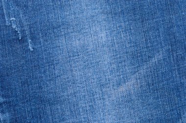 Closeup soyut doğal mavi jeans doku arka plan parçası