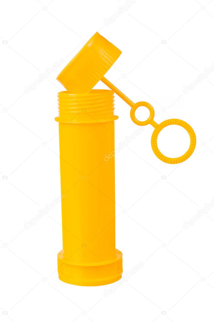 Plastic yellow bottle of soap bubbles isolated on white background