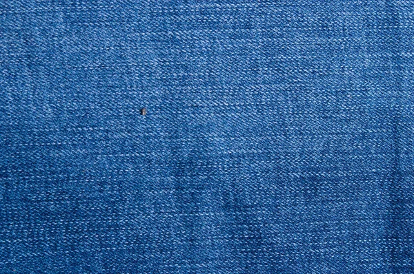 Closeup soyut doğal mavi jeans doku arka plan parçası — Stok fotoğraf