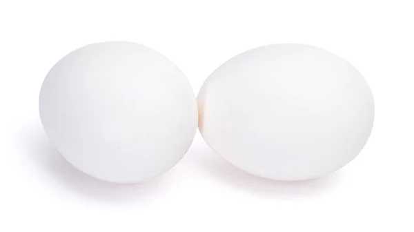 Grupo de dos huevos blancos aislados sobre fondo blanco — Foto de Stock