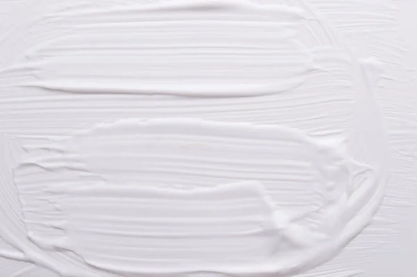 White cream painted with oil paint background texture