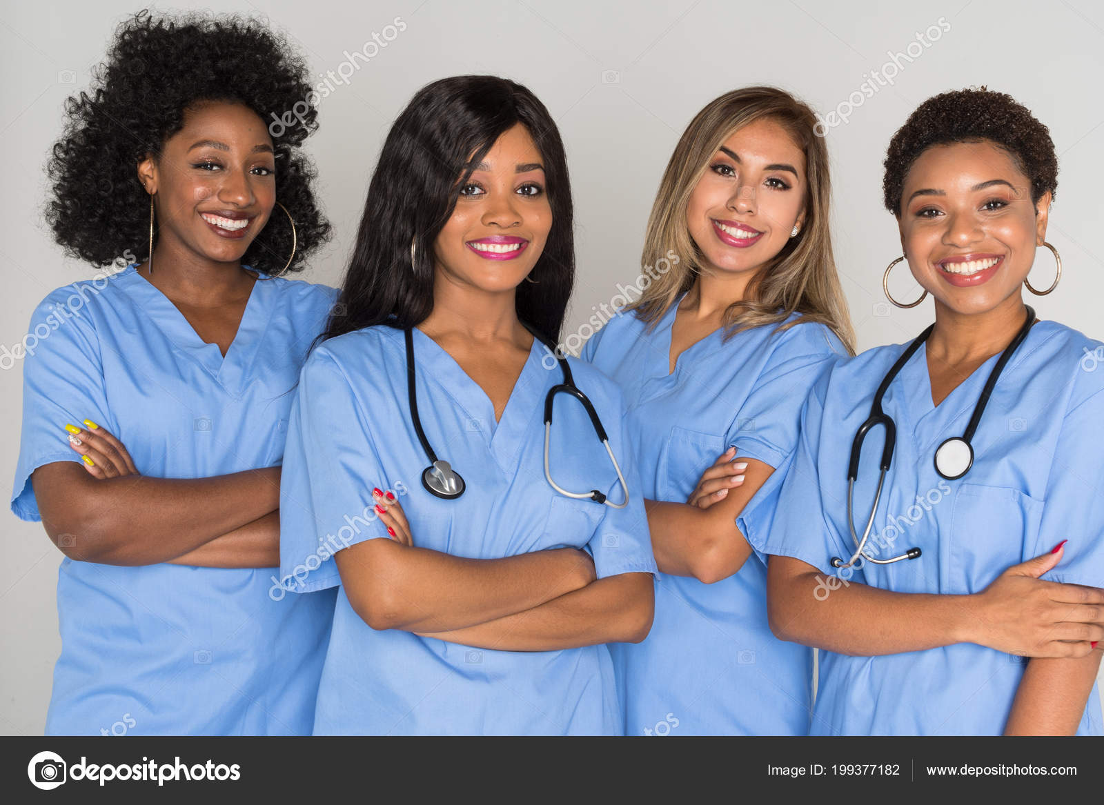 Large Group Female Nurses Working Together Stock Photo by