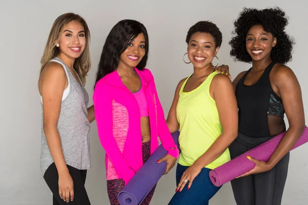 Group of fit minority women working out