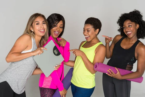 Group of fit minority women working out