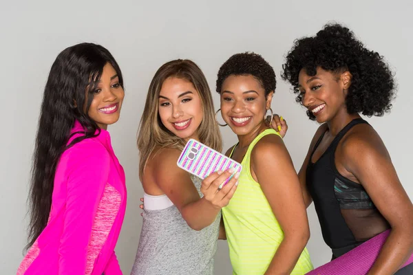 Group of fit minority women working out