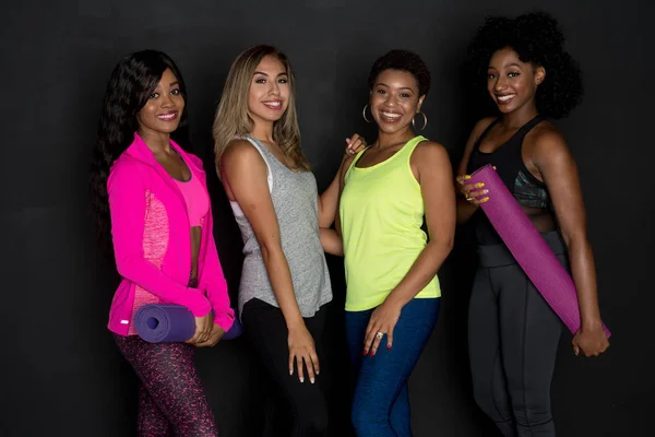 Group of fit minority women working out