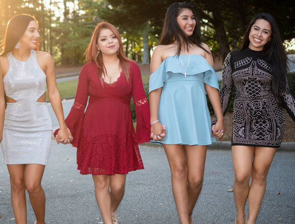 Group of teenage friends at their prom dance