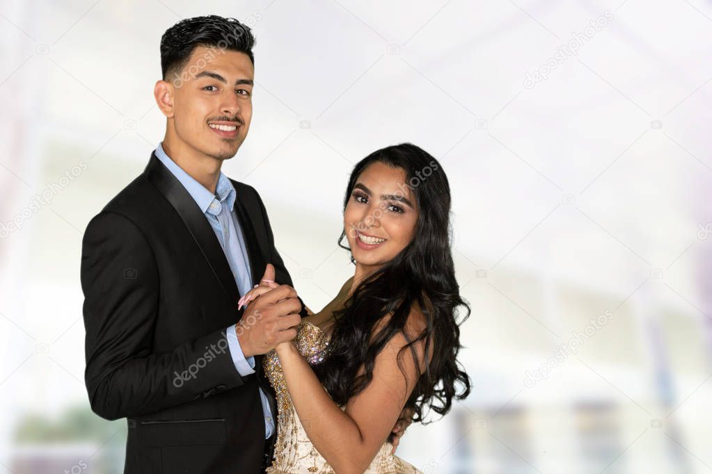 Teen girl celebrating her quinceanera with a nice dress