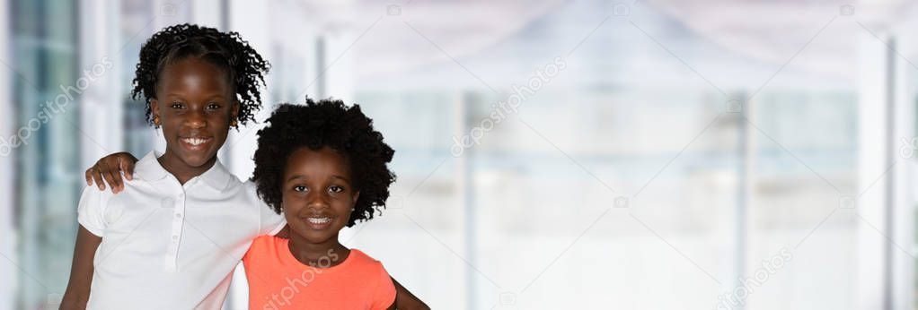 Group of two young african american girls who are sisters