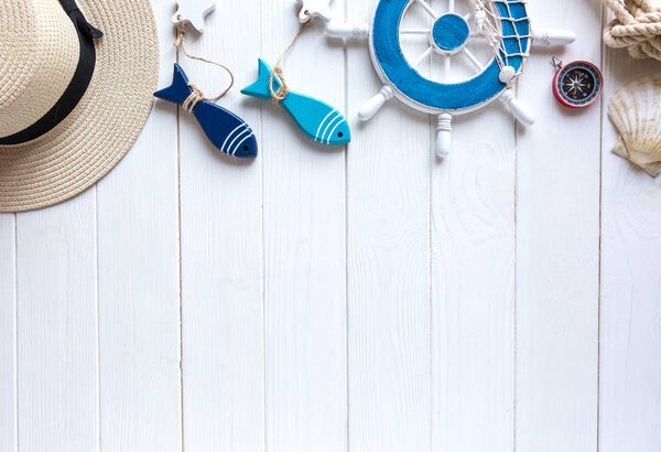 Summer vacation flat lay with beach accessories on wooden background. Travel essentials from above with copy space. 