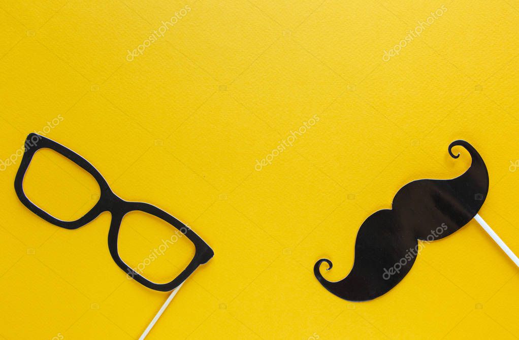 Moustache photo booth props on blue background. Moustache cut outs. Movember Movement. Prostate Cancer Awareness, Men's health awareness concept. flat lay, top view, copyspace
