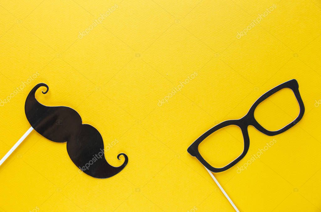 Moustache photo booth props on blue background. Moustache cut outs. Movember Movement. Prostate Cancer Awareness, Men's health awareness concept. flat lay, top view, copyspace