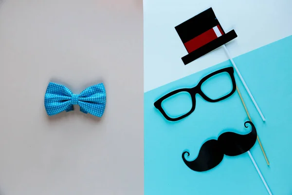 Moustache photo booth props on colorful background. Moustache cut outs. Movember Movement. Prostate Cancer Awareness, Men\'s health awareness, father\'s day concept. flat lay, top view, copyspace