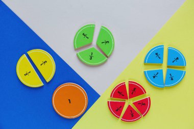 colorful math fractions on the bright backgrounds. interesting math for kids. Education, back to school concept. Geometry and mathematics materials. clipart