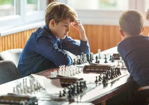 Cute Smart Boy Blue Shirt Plays Chess Chessboard Classroom Hobby — Stock Photo, Image