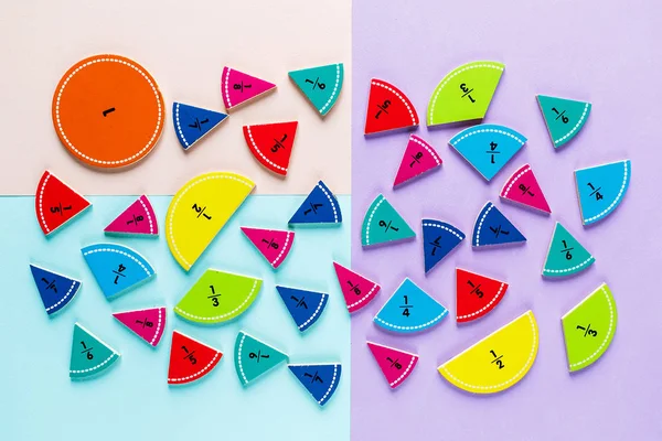 colorful math fractions on the bright backgrounds. interesting math for kids. Education, back to school concept. Geometry and mathematics materials.