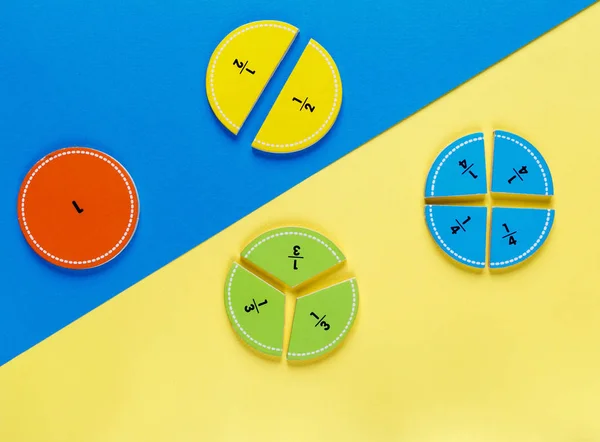 colorful math fractions on the bright backgrounds. interesting math for kids. Education, back to school concept. Geometry and mathematics materials.