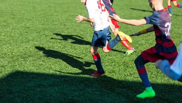 Football training soccer for kids. Boy runs kicks dribbles soccer balls. Young footballers dribble and kick football ball in game. Training, active lifestyle, sport, children activity concept