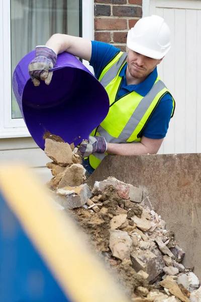 Construction Worker Emptying Building Waste Skip Renovated House — Stock Photo, Image