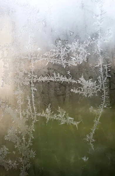 Frost on the window. Green background