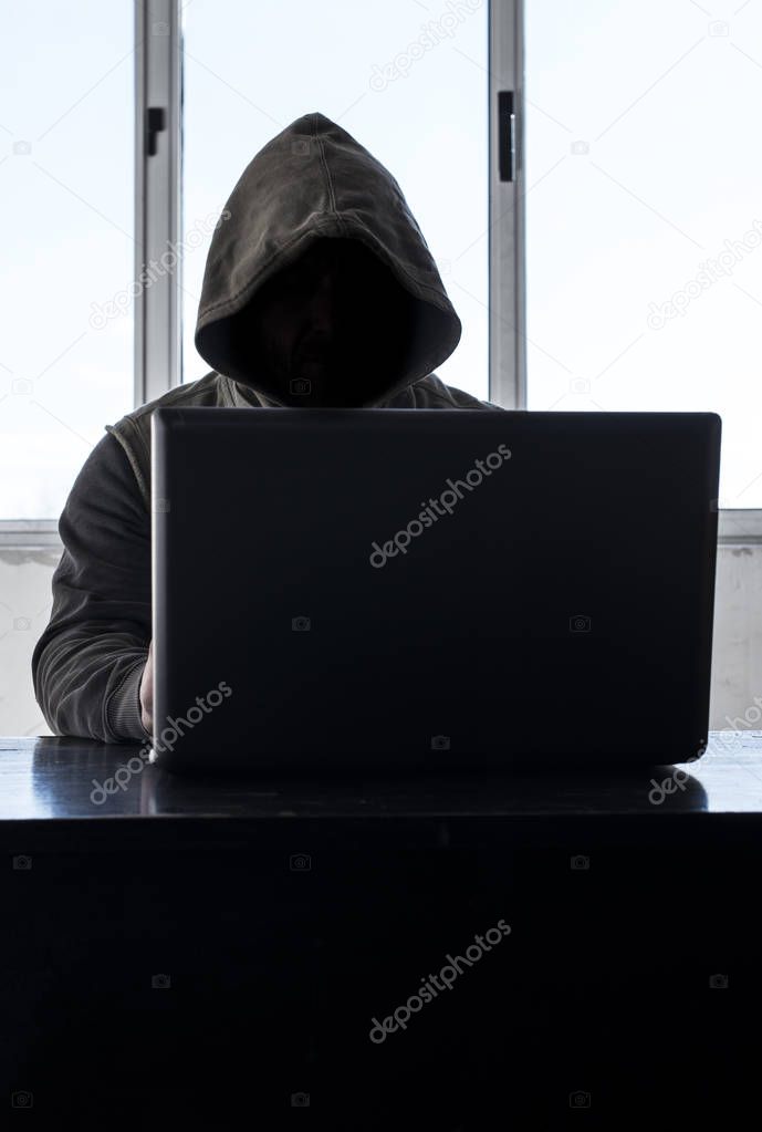 Hacker with hood. Silhouette
