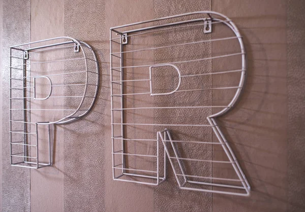 Public Relations concept with 3D letters PR made of stone. PR letters on wall.