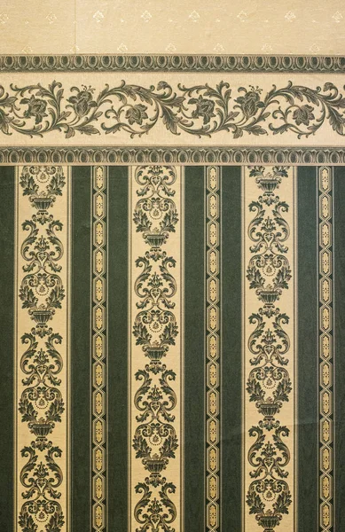 Vintage ornamental green patterns wallpaper. Victorian style backdrop. Natural authentic light.