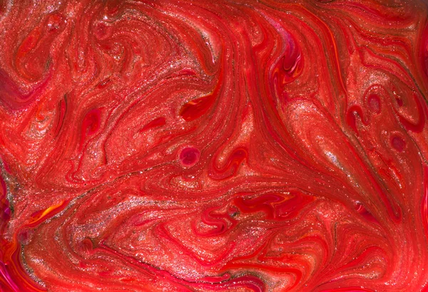 Vibrant red marbling texture. Abstract colorful background. Multicolored pattern in liquid. Creative background with abstract painted waves, handmade surface. Liquid marble paint.