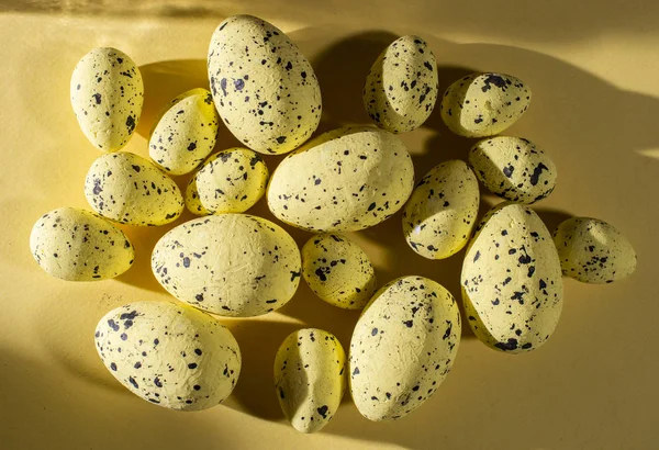 Yellow easter eggs decoration on yellow background on white dots — ストック写真