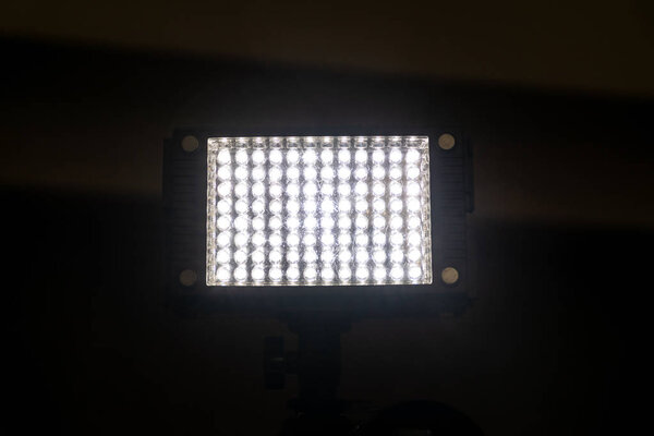 Bright powerful light of a rectangular lantern with LEDs. A bright rectangle on a black background