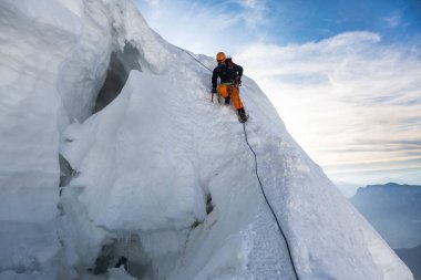 Chamonix-Mont-Blanc, France - August 04, 2019: Mountaineering ascending to the top of mount Mont Blanc in French Alps. clipart