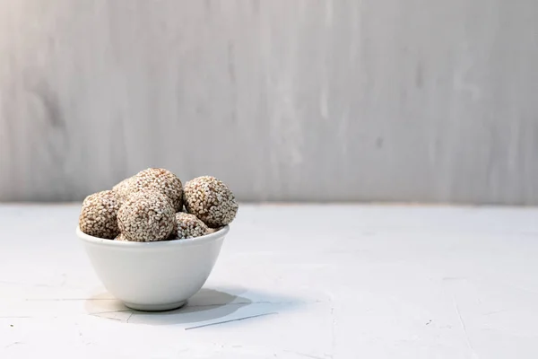 stock image Homemade sweets energy balls made from superfoods like seeds, nuts and dried fruits. Healthy snack, raw dessert and superfood. With space for text