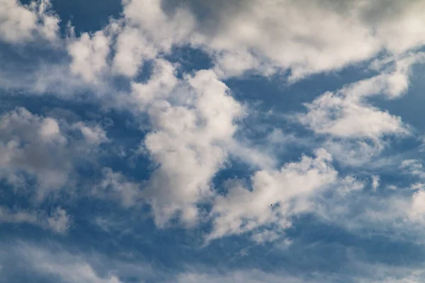 Blue sky with sun behind the clouds. Meditation zen nature