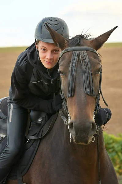 Teenage boy with a horse — Stock Photo, Image