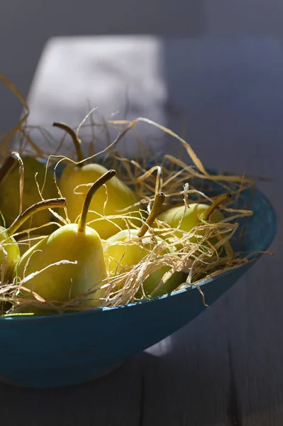 Pears in blue basket — Stock Photo, Image