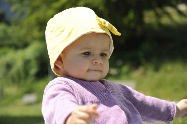 Adorable Little Girl Yellow Hat Sitting Grass Summer — Stock Photo, Image