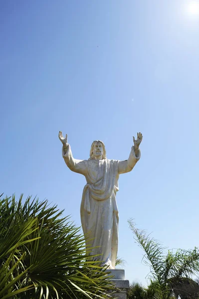 Cristo Redentor statue (Christ the Redeemer Statue). Similar to the statue in Rio de janeiro. Concept of forgiveness. Father who forgives his son.