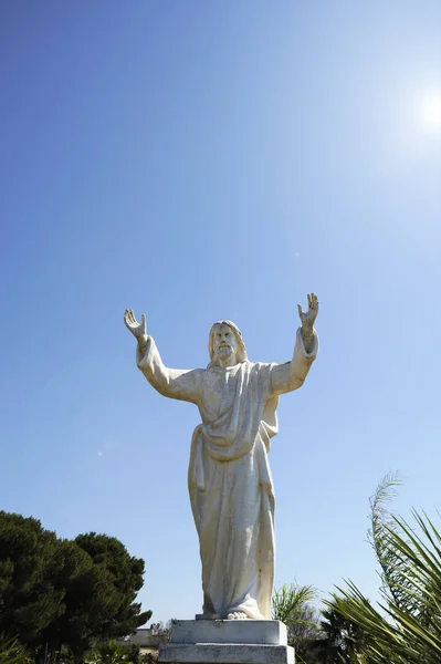 Cristo Redentor statue (Christ the Redeemer Statue). Similar to the statue in Rio de janeiro. Concept of forgiveness. Father who forgives his son.