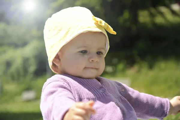 Adorable Little Girl Yellow Hat Sitting Grass Summer — Stock Photo, Image