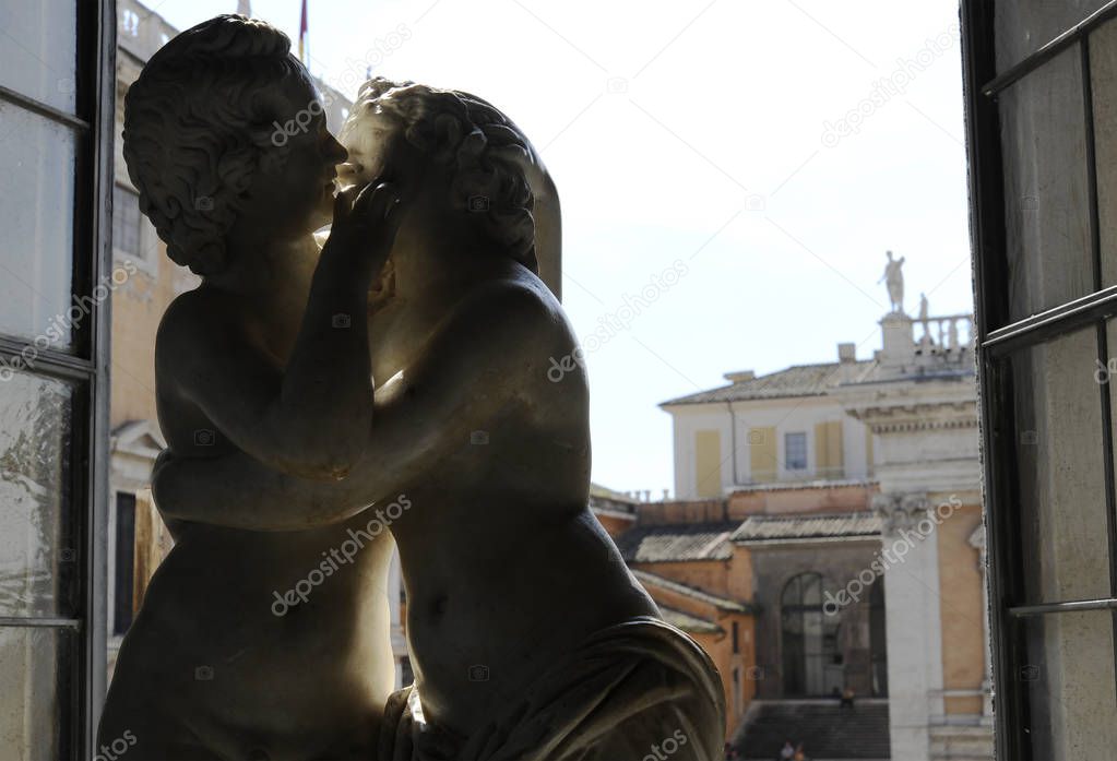 The famous statue of the kiss between Cupid and Psyche in a famous museum in Rome.