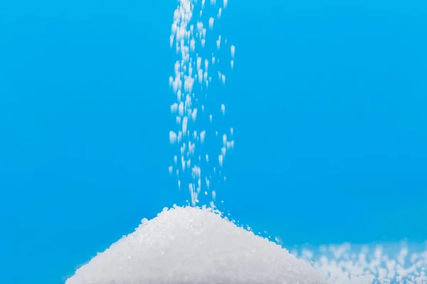 Pouring sugar on a pile of sugar — Stock Photo, Image