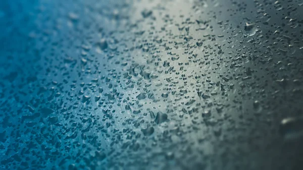 Σταγόνες νερού σε γυαλί, έννοια της βροχής — Φωτογραφία Αρχείου