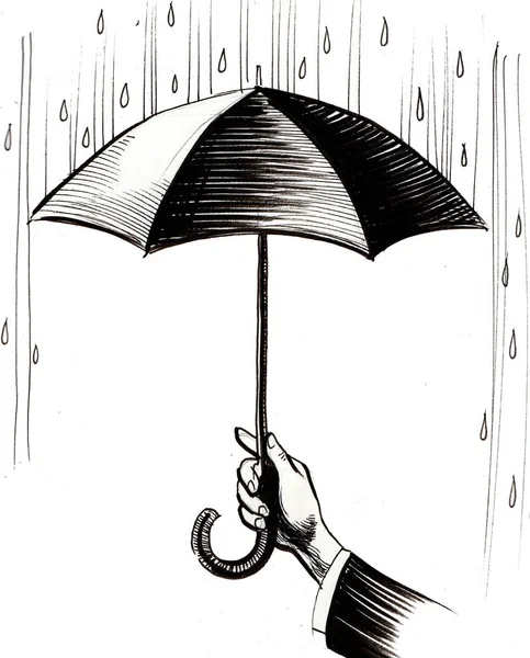 hand with umbrella in the rain