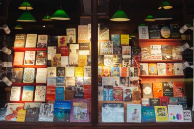 London / UK - March 11, 2018: shop window display the Daunt Books store on the Holland Park Avenue in London, UK. The street is boasts attractive terraces and numerous high-end shops and restaurants clipart