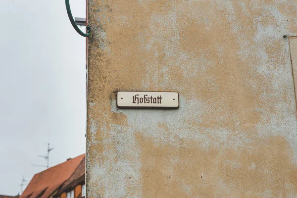 Hofstatt street name signs in Rothenburg ob der Tauber, Germany. A street name sign is a sign used to identify named roads