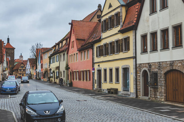 Rothenburg/Germany-1/1/19: colorful houses in an old town in Rothenburg ob der Tauber. The town is well known for its well-preserved medieval old town, a destination for tourists from around the world