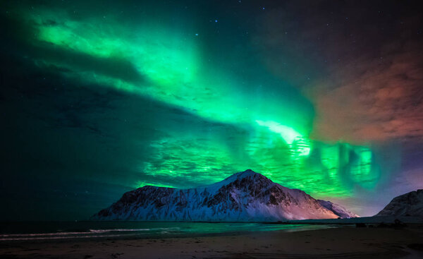 Aurora borealis (northern lights) over Skagsanden beach. Lofoten